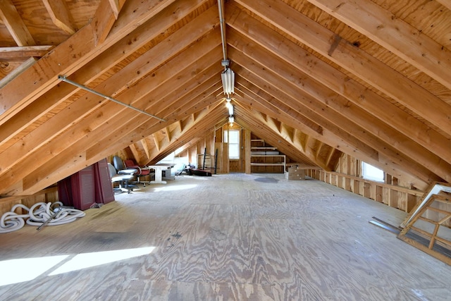 unfinished attic with a healthy amount of sunlight