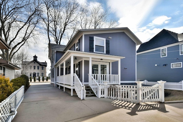 view of front of house with a porch and fence