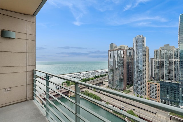 balcony featuring a water view