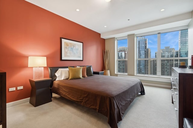 bedroom featuring light colored carpet