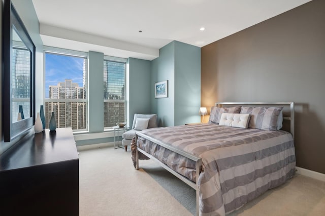 bedroom featuring light colored carpet