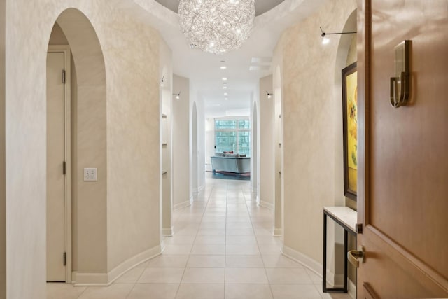 hall featuring light tile patterned floors