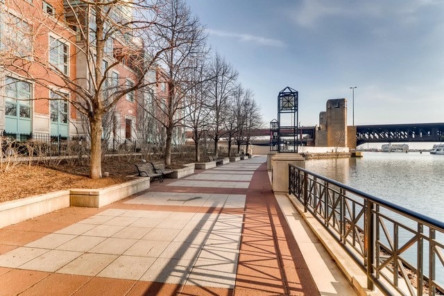 surrounding community featuring a water view