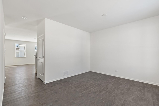 empty room featuring dark hardwood / wood-style floors