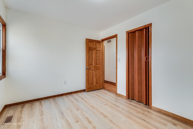 empty room featuring light hardwood / wood-style floors