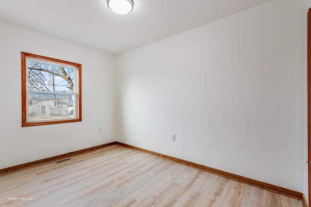 unfurnished room featuring light hardwood / wood-style floors