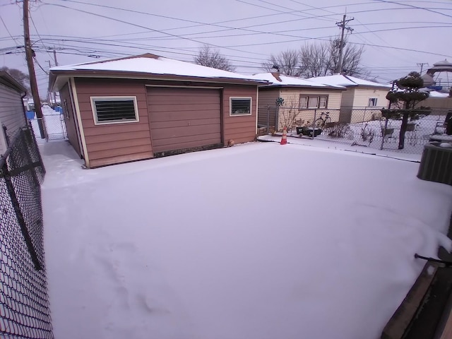 exterior space featuring an outbuilding and a garage