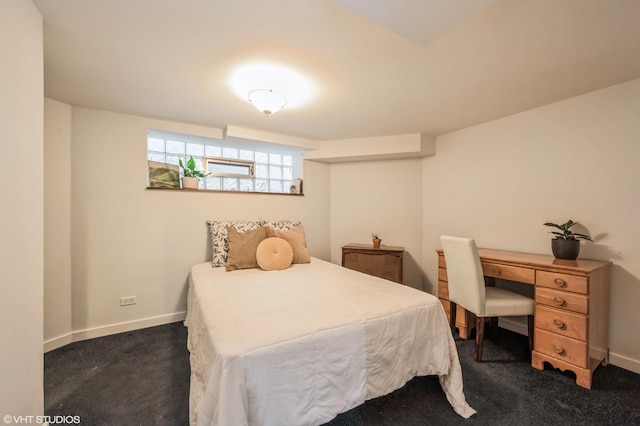 bedroom featuring dark colored carpet