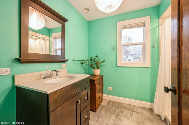 bathroom featuring vanity and walk in shower