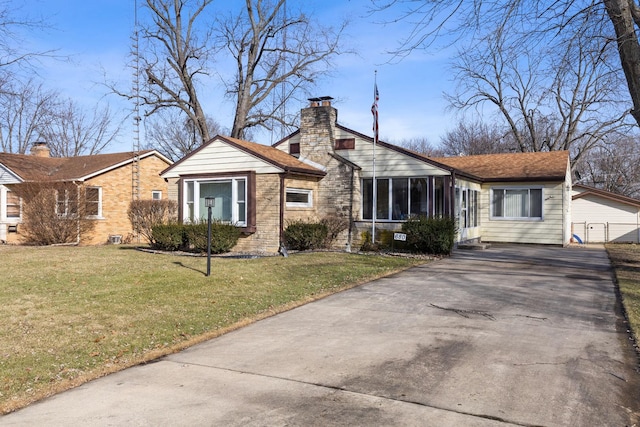 ranch-style home with a front yard