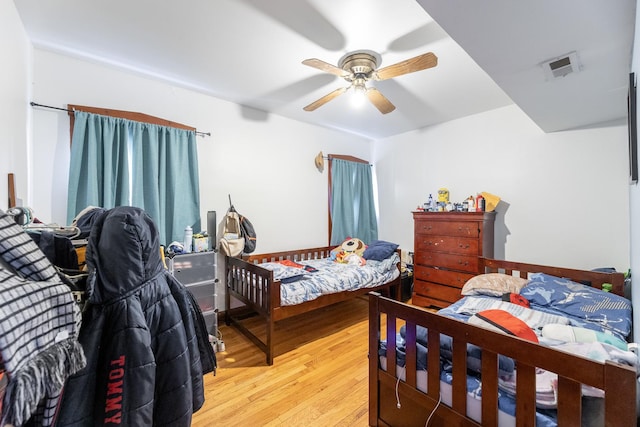 bedroom featuring ceiling fan and light wood-type flooring