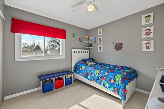 bedroom with carpet floors, ceiling fan, and baseboards