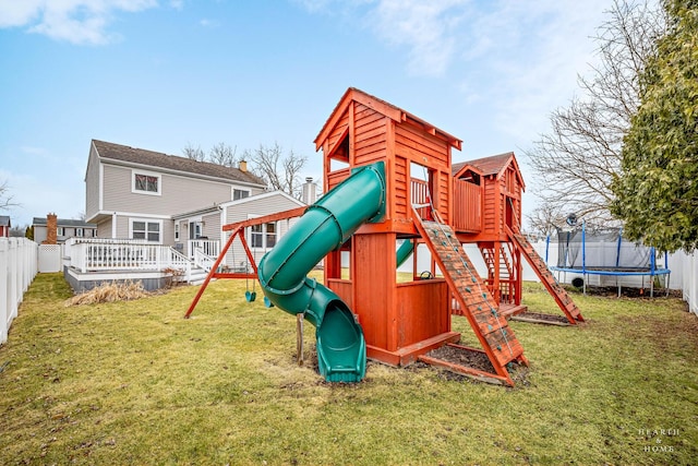 view of playground with a trampoline, a fenced backyard, and a lawn