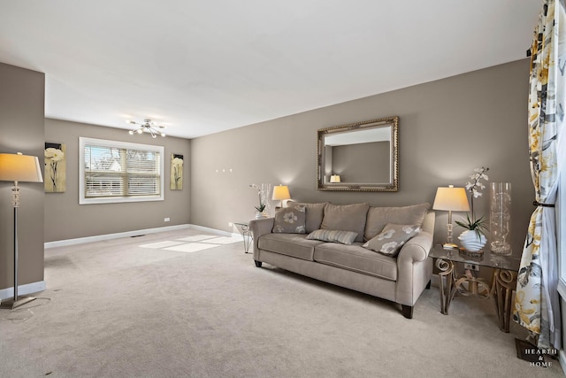 living room featuring carpet flooring and baseboards