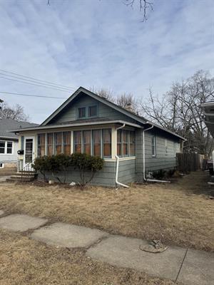 view of front of property with a sunroom