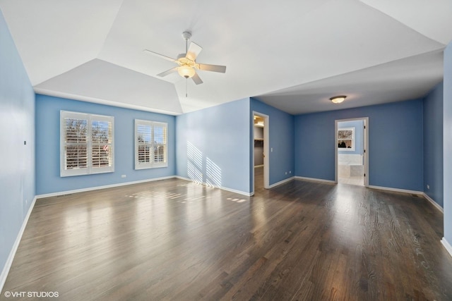 unfurnished living room featuring ceiling fan, lofted ceiling, and dark hardwood / wood-style flooring