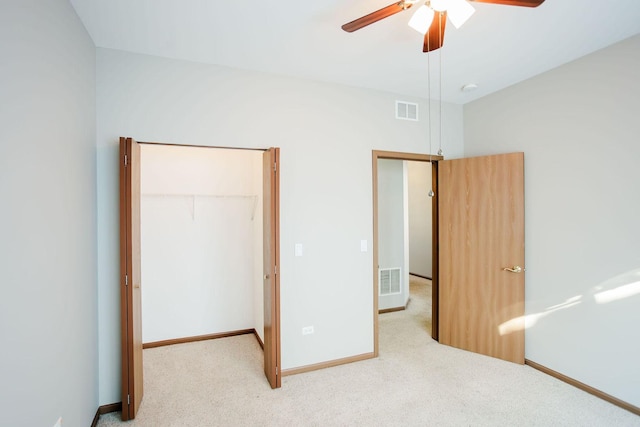 unfurnished bedroom with baseboards, visible vents, and carpet flooring