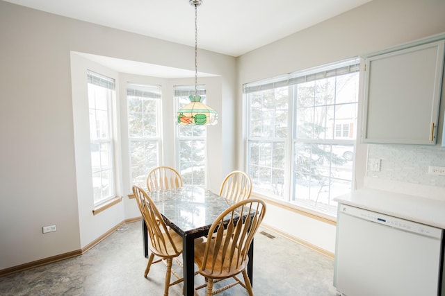 dining space featuring visible vents and baseboards