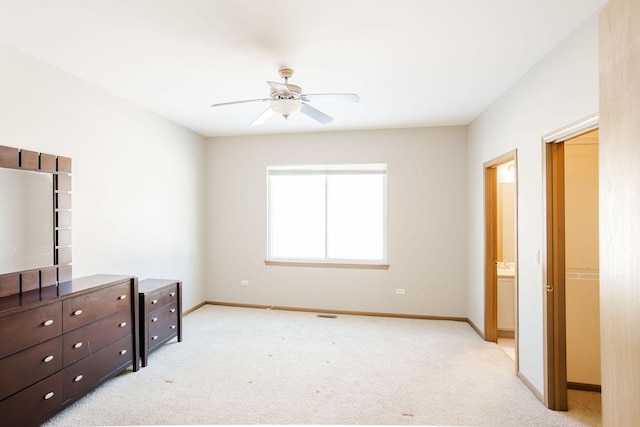 bedroom featuring light carpet, baseboards, and a ceiling fan