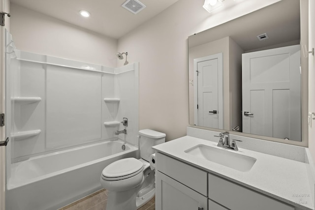 bathroom featuring toilet, visible vents, shower / washtub combination, and vanity