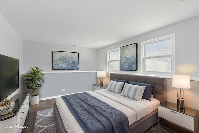 bedroom featuring dark hardwood / wood-style floors