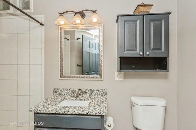 full bath with vanity and toilet