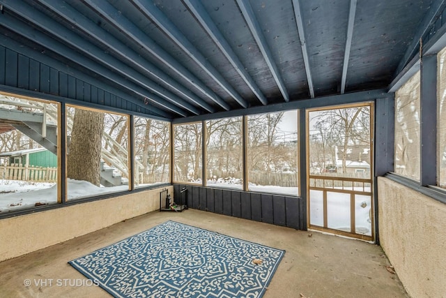 sunroom featuring lofted ceiling