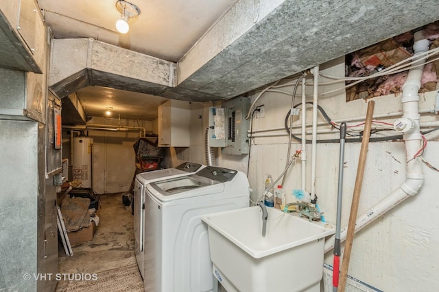 washroom with laundry area, electric panel, independent washer and dryer, water heater, and a sink