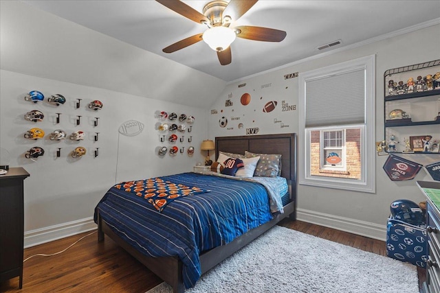 bedroom featuring lofted ceiling, dark wood-style flooring, visible vents, and baseboards