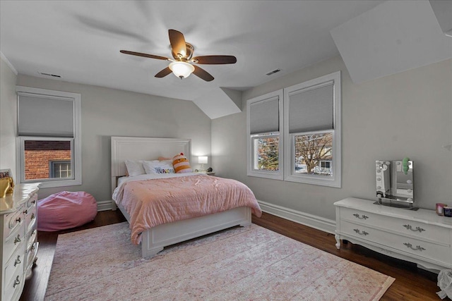 bedroom featuring ceiling fan, visible vents, baseboards, and dark wood-type flooring