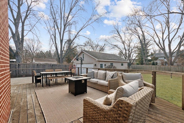 wooden terrace with outdoor dining area, an outdoor living space with a fire pit, and a fenced backyard