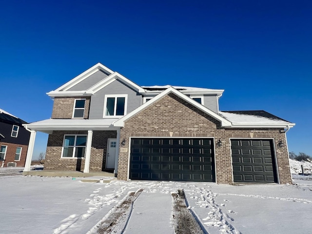 view of front of house with a garage and covered porch