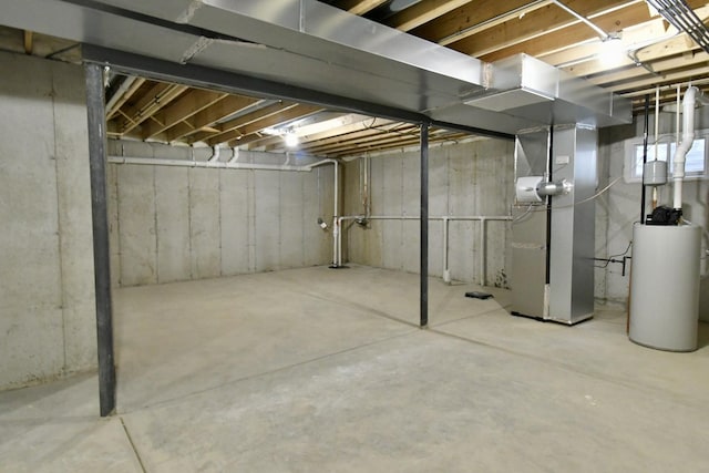 basement featuring gas water heater and heating unit