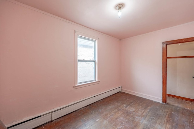 unfurnished bedroom with a baseboard radiator, ornamental molding, and wood-type flooring