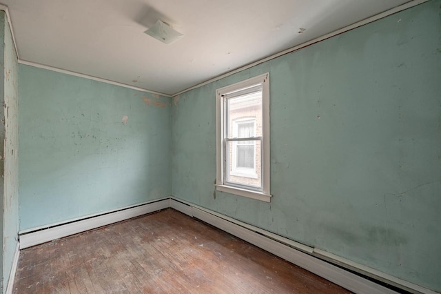 unfurnished room with crown molding and hardwood / wood-style floors