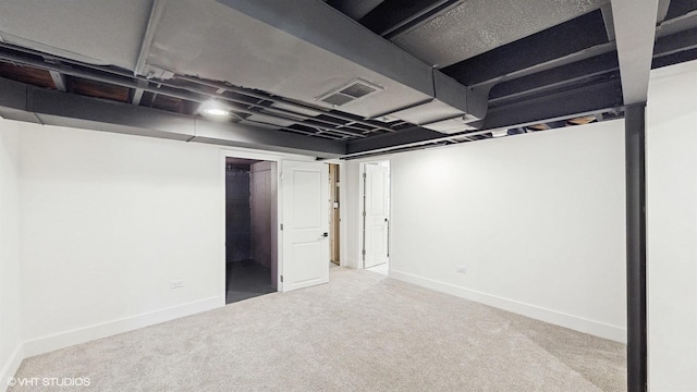 basement with light colored carpet