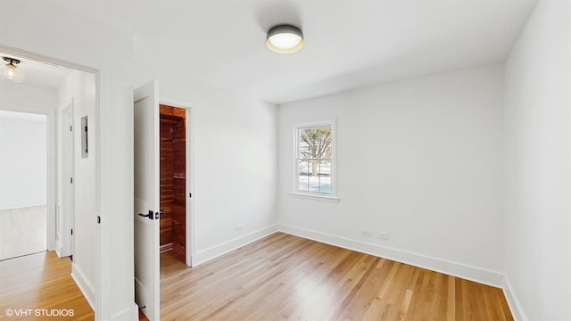 spare room featuring light hardwood / wood-style floors