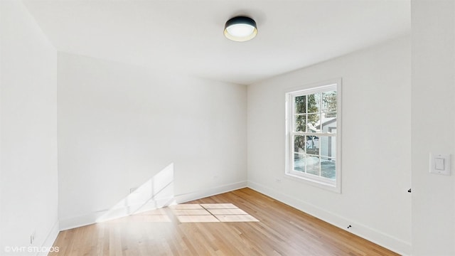 empty room with wood-type flooring