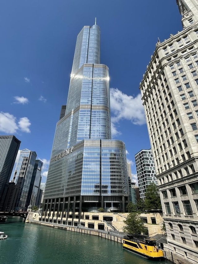 view of property featuring a view of city and a water view