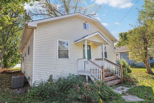 bungalow featuring central AC unit