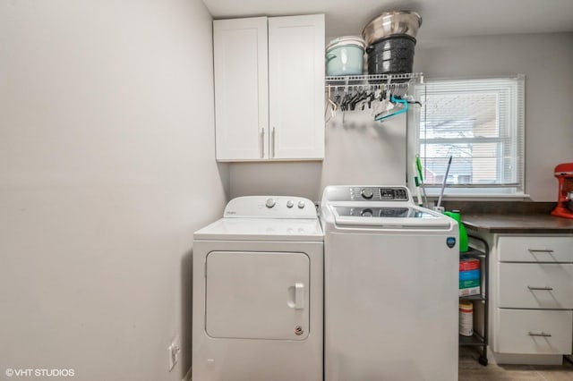 laundry area featuring cabinet space and independent washer and dryer