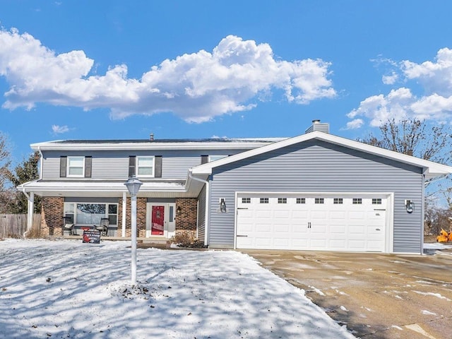 traditional-style home with brick siding and an attached garage