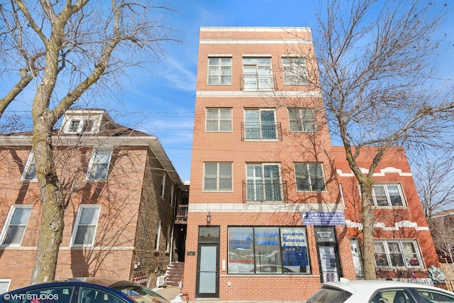 view of front of home with brick siding