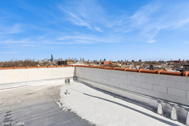 view of yard featuring fence and a city view