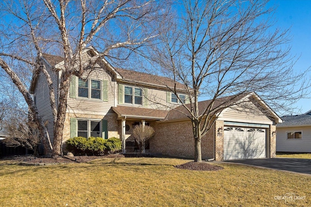 traditional home featuring driveway, brick siding, an attached garage, and a front yard