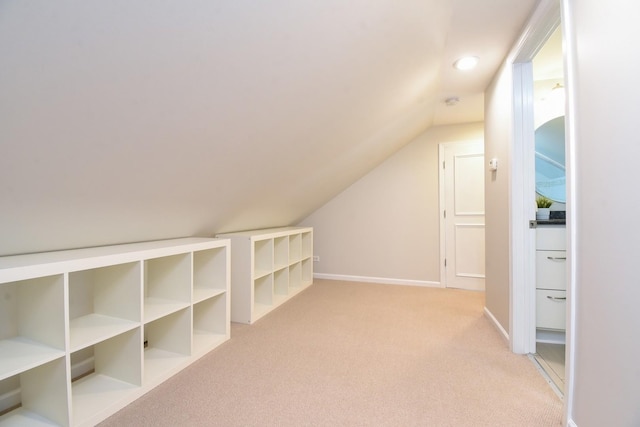 bonus room featuring recessed lighting, baseboards, vaulted ceiling, and light colored carpet