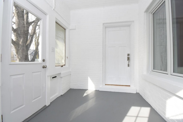 entryway with finished concrete floors