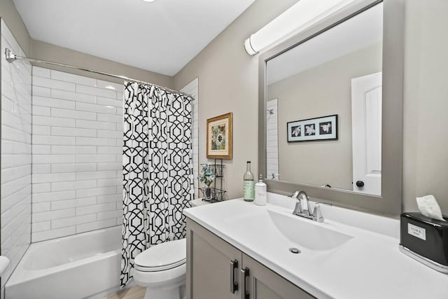 full bathroom featuring vanity, toilet, and shower / tub combo