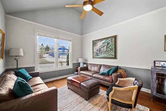 living room featuring hardwood / wood-style flooring, vaulted ceiling, and ceiling fan