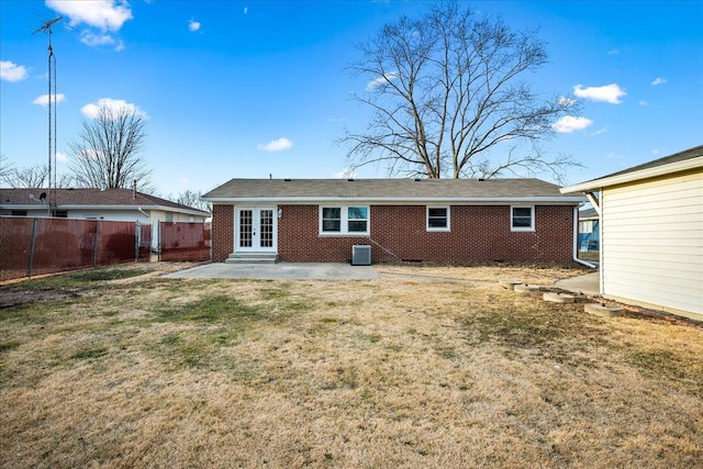 back of property featuring a yard, a patio area, and central air condition unit